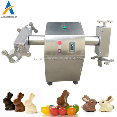 Máquina de moldear del chocolate del chocolate eléctrico hueco de la hiladora