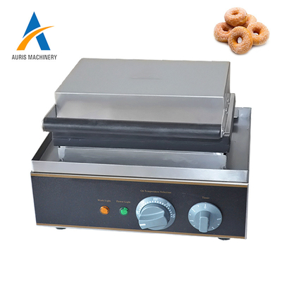 El fabricante comercial del buñuelo de la placa de prensa trabaja a máquina los buñuelos múltiples autos
